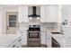 Newly remodeled kitchen featuring white cabinetry, stainless steel appliances, and stylish countertops at 5452 E University Dr, Mesa, AZ 85205