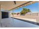 Covered patio with view of the spacious, gravel-covered backyard at 5452 E University Dr, Mesa, AZ 85205