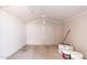 A simple shed with concrete floor, white walls, and contents scattered along the lower right at 5452 E University Dr, Mesa, AZ 85205