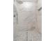 Shower with sleek, modern fixtures and floor-to-ceiling marble tiling at 5452 E University Dr, Mesa, AZ 85205