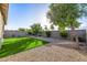 This low-maintenance backyard boasts gravel and artificial turf, ideal for easy living at 5752 N 109Th Ave, Phoenix, AZ 85037