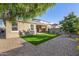 This home has a pristine artificial grass lawn and an inviting covered patio that is perfect for relaxing at 5752 N 109Th Ave, Phoenix, AZ 85037