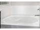 Close-up of a soaking tub with chrome fixtures at 5752 N 109Th Ave, Phoenix, AZ 85037
