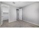 An empty bedroom with neutral colored walls, carpet and closet at 5752 N 109Th Ave, Phoenix, AZ 85037
