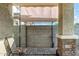 The covered patio features stylish stone pillars and a paved walkway, offering a cozy space at 5752 N 109Th Ave, Phoenix, AZ 85037