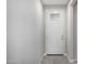 Clean entryway featuring tile floors and a white door with a window at 5752 N 109Th Ave, Phoenix, AZ 85037