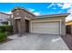 Charming single-Gathering home featuring a two-car garage and stone accents at 5752 N 109Th Ave, Phoenix, AZ 85037