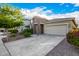 Charming single-Gathering home featuring a two-car garage, stone accents, and lush landscaping at 5752 N 109Th Ave, Phoenix, AZ 85037