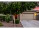 Home with a two-car garage, stone accents, and low maintenance landscaping at 5752 N 109Th Ave, Phoenix, AZ 85037