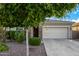 Home featuring a two-car garage, stone accents, and low maintenance landscaping at 5752 N 109Th Ave, Phoenix, AZ 85037
