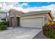 Charming single-Gathering home featuring a two-car garage, stone accents, and lush landscaping at 5752 N 109Th Ave, Phoenix, AZ 85037