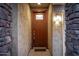 Inviting front door with sidelight and stone accents at 5752 N 109Th Ave, Phoenix, AZ 85037