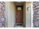 Inviting covered front door with a window and modern lighting fixture at 5752 N 109Th Ave, Phoenix, AZ 85037