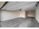 Spacious and clean garage with ample room for parking and storage, featuring a well-maintained concrete floor at 5752 N 109Th Ave, Phoenix, AZ 85037