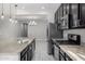 Spacious kitchen featuring stainless steel appliances, granite countertops, and ample cabinet space at 5752 N 109Th Ave, Phoenix, AZ 85037