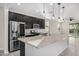 Modern kitchen boasts stainless steel appliances, granite countertops, and a spacious island at 5752 N 109Th Ave, Phoenix, AZ 85037