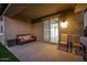 Comfortable covered patio with stylish seating, perfect for relaxing or entertaining in the serene outdoor space at 5752 N 109Th Ave, Phoenix, AZ 85037