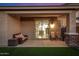 Comfortable covered patio with stylish seating, perfect for relaxing or entertaining in the serene outdoor space at 5752 N 109Th Ave, Phoenix, AZ 85037