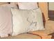 A decorative pillow invites comfort and relaxation on the outdoor seating at 5752 N 109Th Ave, Phoenix, AZ 85037