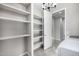 Bright, organized storage area with ample shelving for efficient and accessible home storage solutions at 5752 N 109Th Ave, Phoenix, AZ 85037