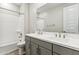 Modern bathroom features a double sink vanity, stylish fixtures, and a shower-tub combination at 5828 E Covey Ln, Phoenix, AZ 85054