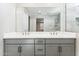 Modern bathroom featuring a double vanity, sleek countertops, and a spacious shower at 5828 E Covey Ln, Phoenix, AZ 85054