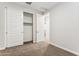 Inviting bedroom featuring carpet, closet, and ample light, offering comfort and style at 5828 E Covey Ln, Phoenix, AZ 85054