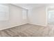 Bright, carpeted bedroom with neutral walls and large windows at 5828 E Covey Ln, Phoenix, AZ 85054