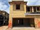 Under construction two-story home featuring wood framing and a spacious two-car garage in a residential area at 5828 E Covey Ln, Phoenix, AZ 85054