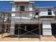 Exterior view of home construction showing windows, insulation, and two-car garage at 5828 E Covey Ln, Phoenix, AZ 85054