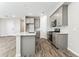 Charming kitchen with gray cabinets, stainless appliances, and island at 5828 E Covey Ln, Phoenix, AZ 85054