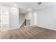 Cozy loft area with carpeted flooring and access to bedrooms at 5828 E Covey Ln, Phoenix, AZ 85054