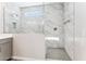 Beautiful tile shower showcasing contemporary design with glass enclosure and modern fixtures at 5828 E Covey Ln, Phoenix, AZ 85054