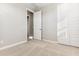 Carpeted bedroom featuring neutral paint and a closet with built-in shelving at 5856 E Covey Ln, Phoenix, AZ 85054
