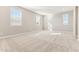 Bright and spacious bedroom with neutral carpeting, recessed lighting, and multiple windows at 5856 E Covey Ln, Phoenix, AZ 85054