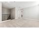 Upstairs bedroom featuring direct access to the stairwell with black iron railing at 5856 E Covey Ln, Phoenix, AZ 85054