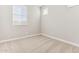 Empty carpeted bedroom featuring neutral paint and a window with wooden blinds at 5856 E Covey Ln, Phoenix, AZ 85054