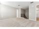 Neutral carpet and paint accentuate the bedroom with direct access to the stairwell at 5856 E Covey Ln, Phoenix, AZ 85054