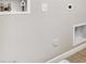 Clean Laundry room with water and drain hookups for easy appliance installation at 5856 E Covey Ln, Phoenix, AZ 85054