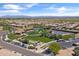 A community center and pool with well-maintained landscaping, tennis courts, and ample parking at 644 E Las Puertas Ln, Queen Creek, AZ 85140