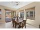 Bright dining area with sliding glass doors, natural light, and views of the outdoor pool at 644 E Las Puertas Ln, Queen Creek, AZ 85140