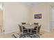 Cozy dining area with a modern table set and views of a decorative television set at 644 E Las Puertas Ln, Queen Creek, AZ 85140
