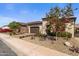 A beautifully landscaped single-Gathering home with a two-car garage and desert-style front yard at 644 E Las Puertas Ln, Queen Creek, AZ 85140