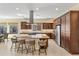Kitchen with island featuring seating, pendant lights, and stainless steel appliances; perfect for cooking at 644 E Las Puertas Ln, Queen Creek, AZ 85140