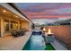 Backyard featuring a refreshing pool, a relaxing spa, and an inviting patio, great for enjoying the outdoors at 644 E Las Puertas Ln, Queen Creek, AZ 85140