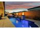 Resort-style backyard with a stunning pool, a spa, and a relaxing patio, creating the ultimate outdoor escape at 644 E Las Puertas Ln, Queen Creek, AZ 85140