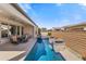 Stunning pool with a water feature, a hot tub, and an outdoor dining area, creating an ideal backyard retreat at 644 E Las Puertas Ln, Queen Creek, AZ 85140