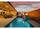 Beautiful pool with a fire feature, a hot tub, and a covered patio, designed for ultimate relaxation and entertaining at 644 E Las Puertas Ln, Queen Creek, AZ 85140