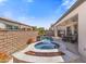Beautiful backyard with pool, spa, outdoor kitchen, and covered patio perfect for entertaining at 644 E Las Puertas Ln, Queen Creek, AZ 85140