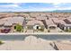 A street view of homes with desert landscaping and tile roofs nestled in a beautiful and modern community at 644 E Las Puertas Ln, Queen Creek, AZ 85140